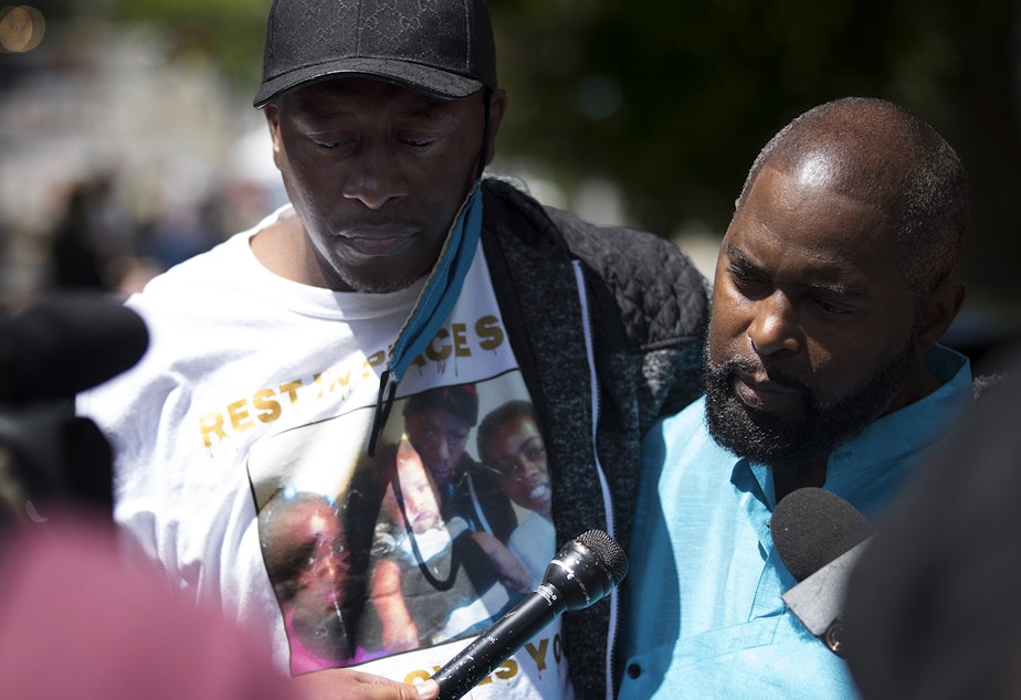 caption: Horace Lorenzo Anderson Sr., left, and Andre Taylor, right, stand together during a press briefing regarding the death of Anderson's 19-year-old son, Horace Lorenzo Daeshawn Anderson, following a shooting on June 20, outside the Capitol Hill Organized Protest zone on Monday, June 29, 2020, in Seattle. "No one was there," said Anderson. "Somebody should have been helping him. Someone from the Police Department should have been helping him." 