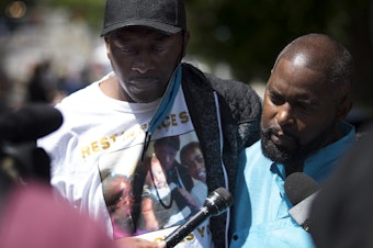 caption: Horace Lorenzo Anderson Sr., left, and Andre Taylor, right, stand together during a press briefing regarding the death of Anderson's 19-year-old son, Horace Lorenzo Daeshawn Anderson, following a shooting on June 20, outside the Capitol Hill Organized Protest zone on Monday, June 29, 2020, in Seattle. "No one was there," said Anderson. "Somebody should have been helping him. Someone from the Police Department should have been helping him." 