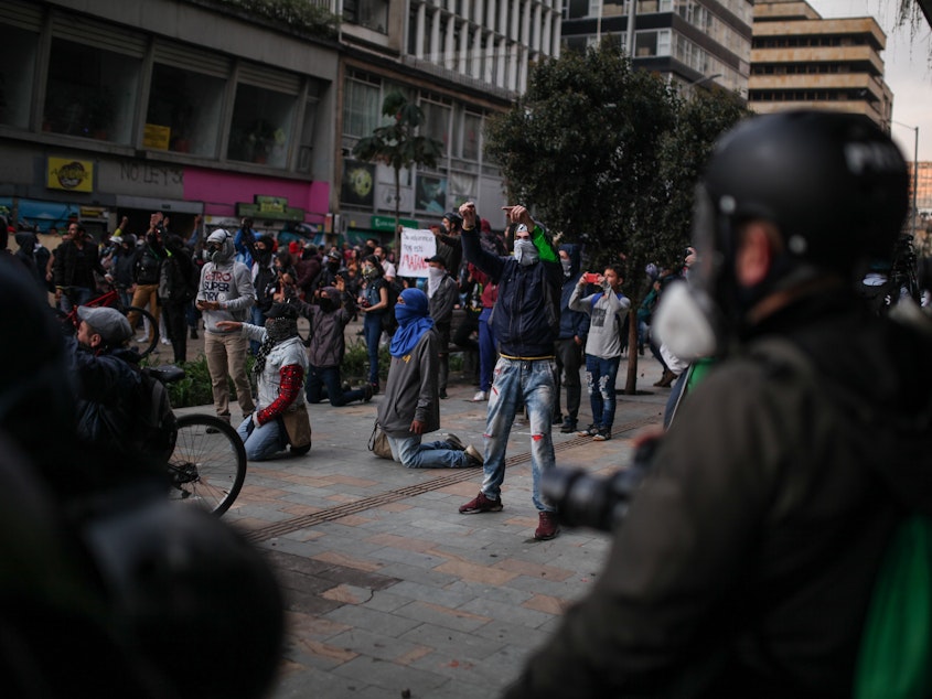 caption: Anti-government protesters rally on Friday in Bogotá, the second day of their protests against President Iván Duque, who is trying to get a grip on the unrest by announcing a "national dialogue."