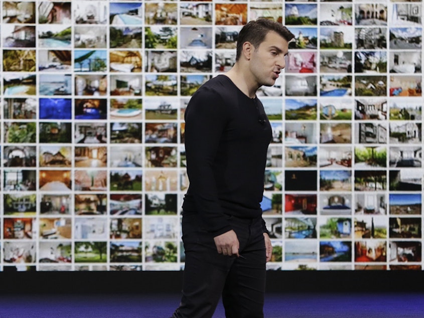 caption: Airbnb co-founder and CEO Brian Chesky during an event in 2018. On Tuesday, the company announced it is laying off 1,900 employees, or about a quarter its workforce, as the coronavirus rattles the travel industry.