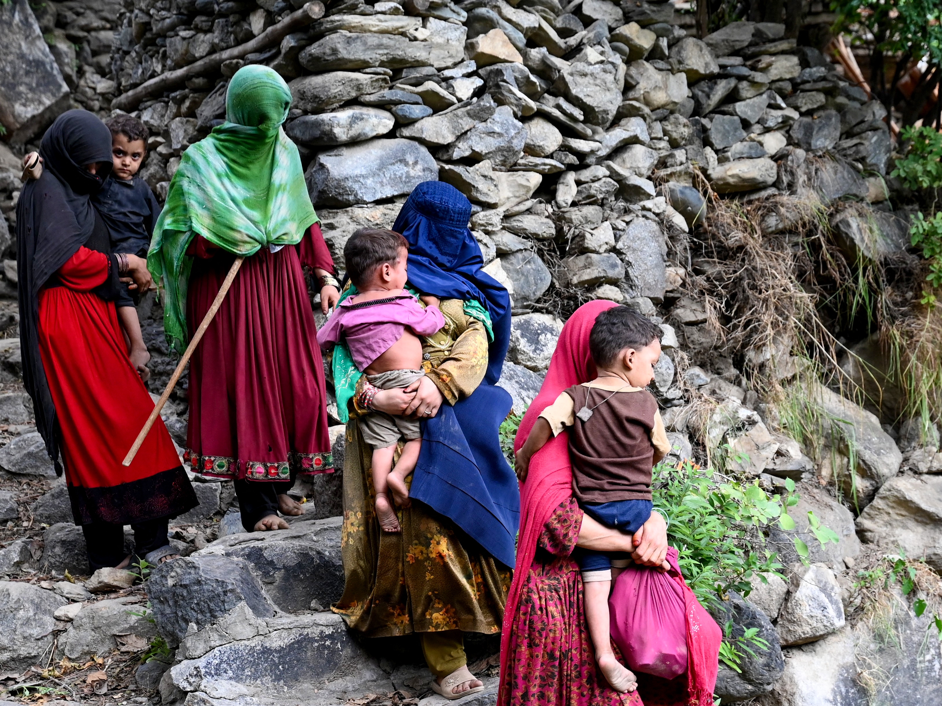 caption: Afghan women and their children at Mazar Dara village after a 6-magnitude earthquake on August 31. More than 800 people have died and over 2,700 were injured in eastern Afghanistan from the quake and aftershocks.