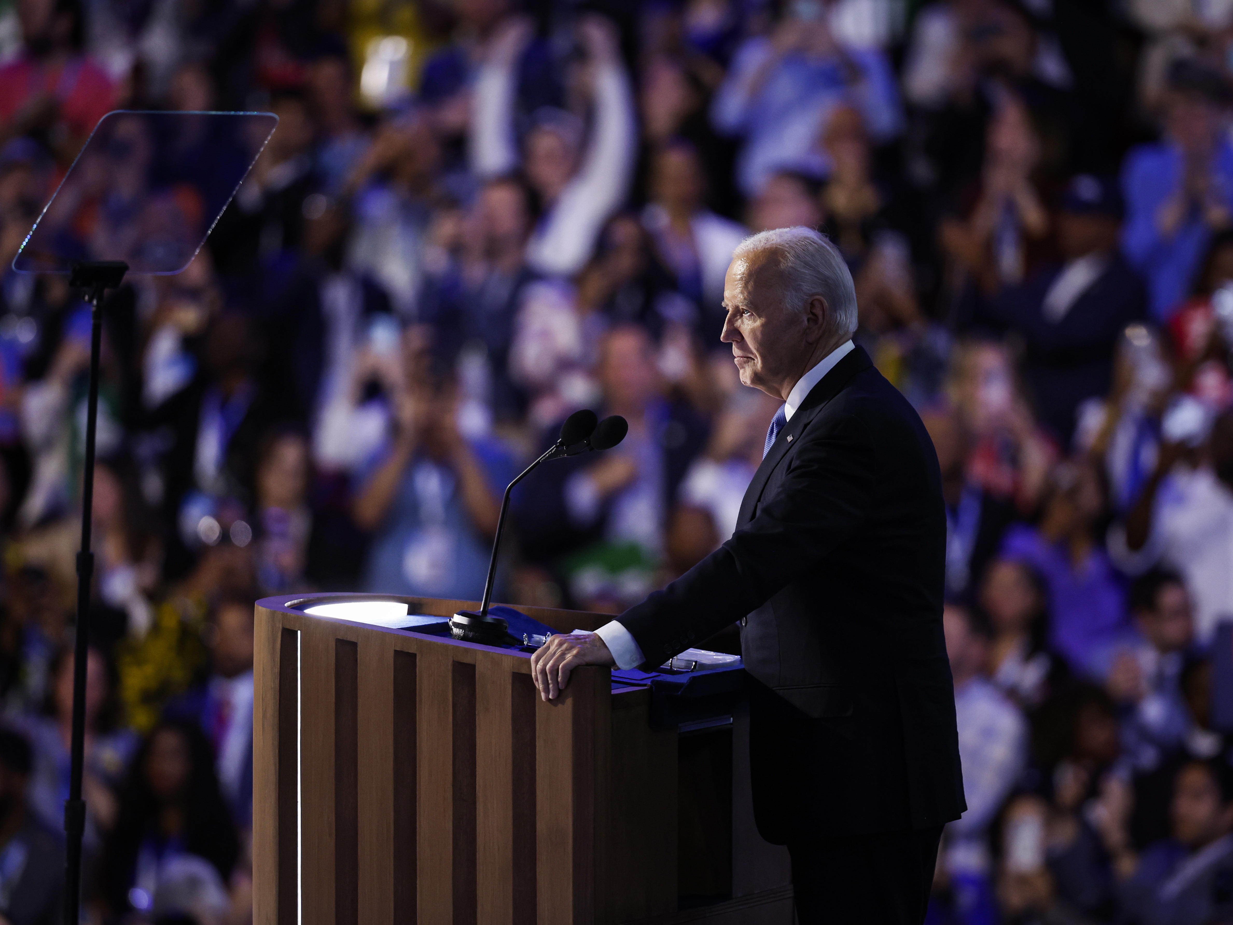 caption: President Joe Biden speaks onstage during the first day of the Democratic National Convention at the United Center on August 19, 2024 in Chicago.