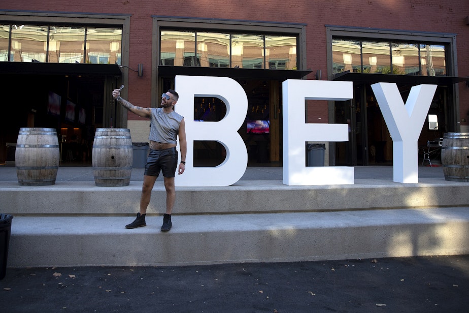 caption: Zachary Gasper takes a selfie ahead of Beyonce’s Seattle stop on the Renaissance World Tour on Thursday, Sept. 14, 2023, near Lumen Field in Seattle.