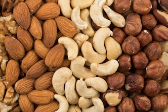 caption: U.S. adults put on about a pound a year on average. But people who had a regular nut-snacking habit put on less weight and had a lower risk of becoming obese over time, a new study finds.