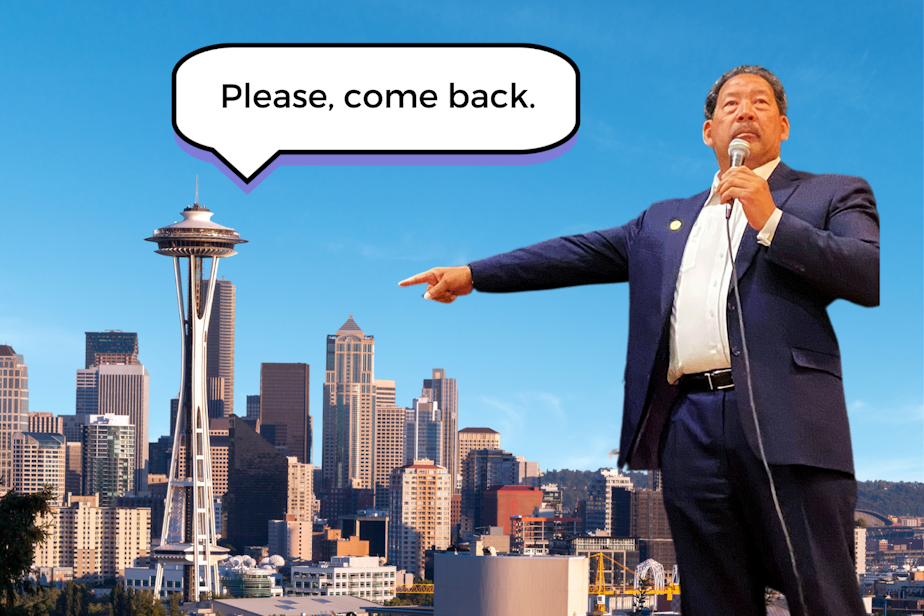 caption: Seattle Mayor Bruce Harrell points toward the Seattle skyline, which is saying, "Please, come back."