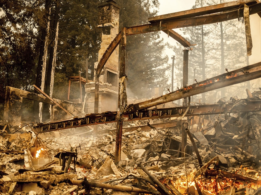 caption: Charred framing remains, Monday, Sept. 28, at the Restaurant at Meadowood, which burned in the Glass Fire, in St. Helena, Calif.