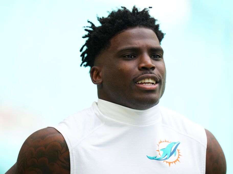 caption: Tyreek Hill warms up prior to a Miami Dolphins game against the Las Vegas Raiders at Hard Rock Stadium on Nov. 17 in Miami Gardens, Fla.