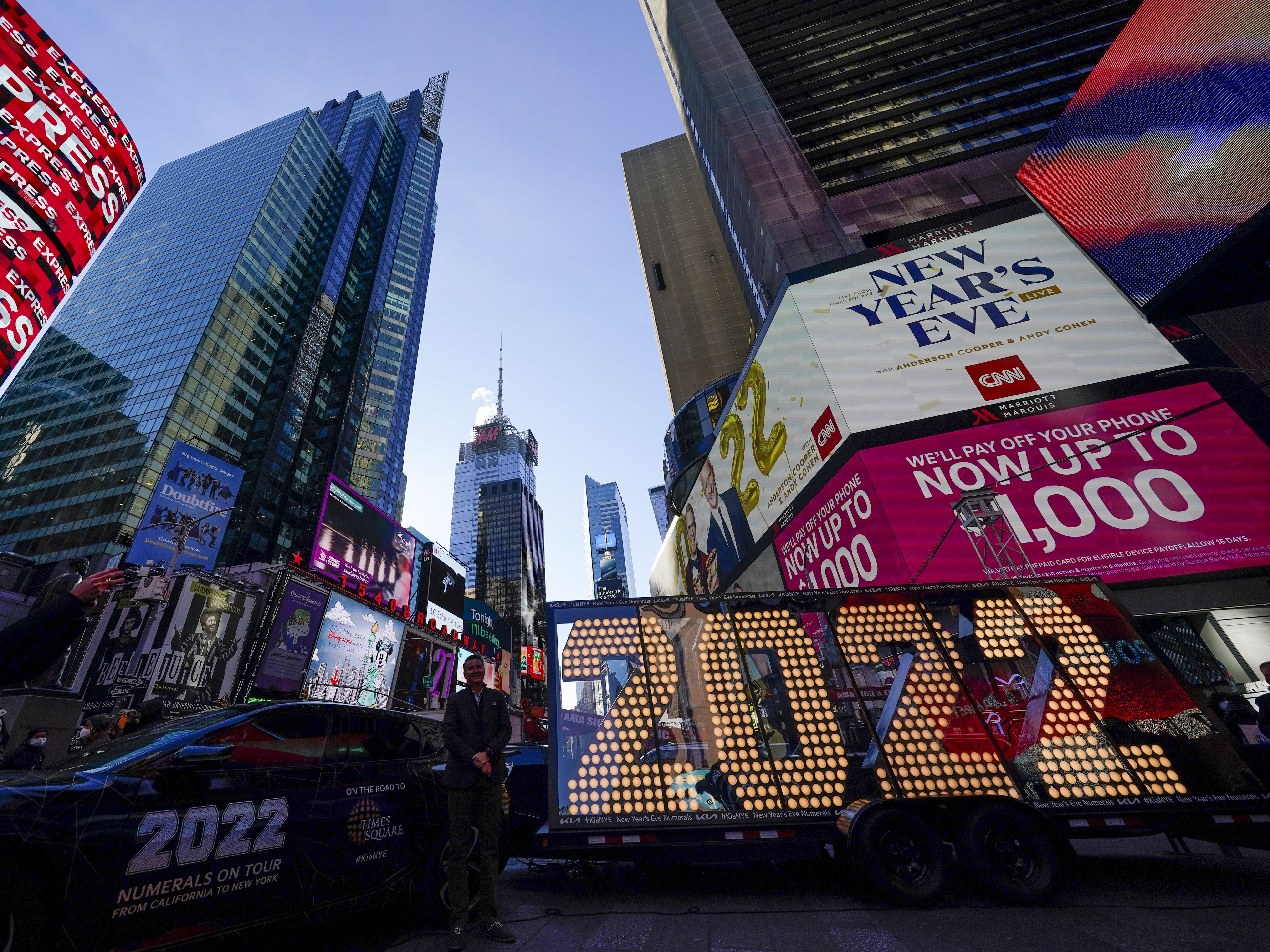 caption: The 2022 sign that will be lit on top of a building on New Year's Eve is displayed in Times Square, New York, Monday, Dec. 20, 2021.