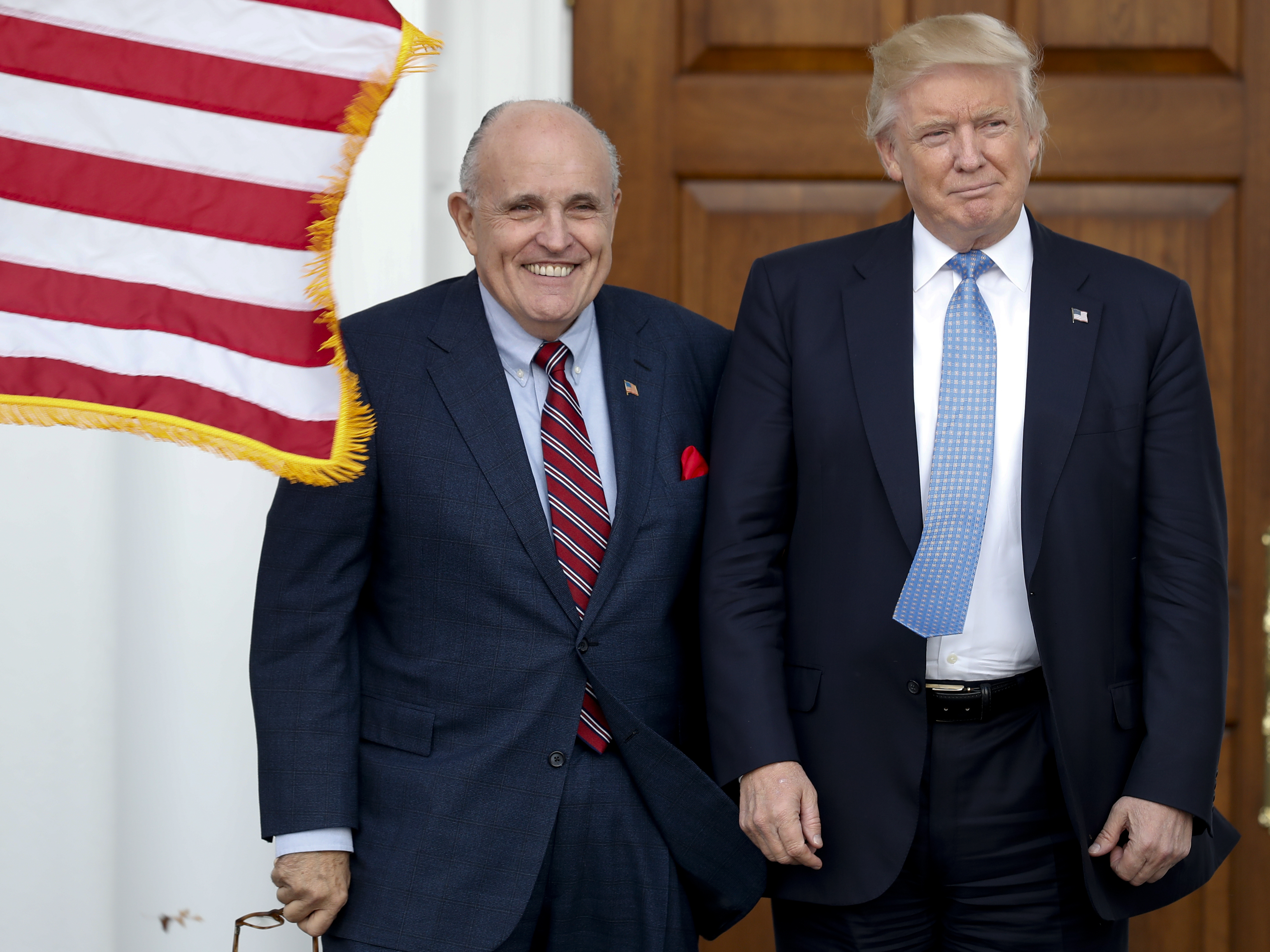 caption: Rudy Giuliani is seen here with Donald Trump in 2016. Federal authorities executed a search warrant on Giuliani's apartment, a person familiar with the matter tells NPR.