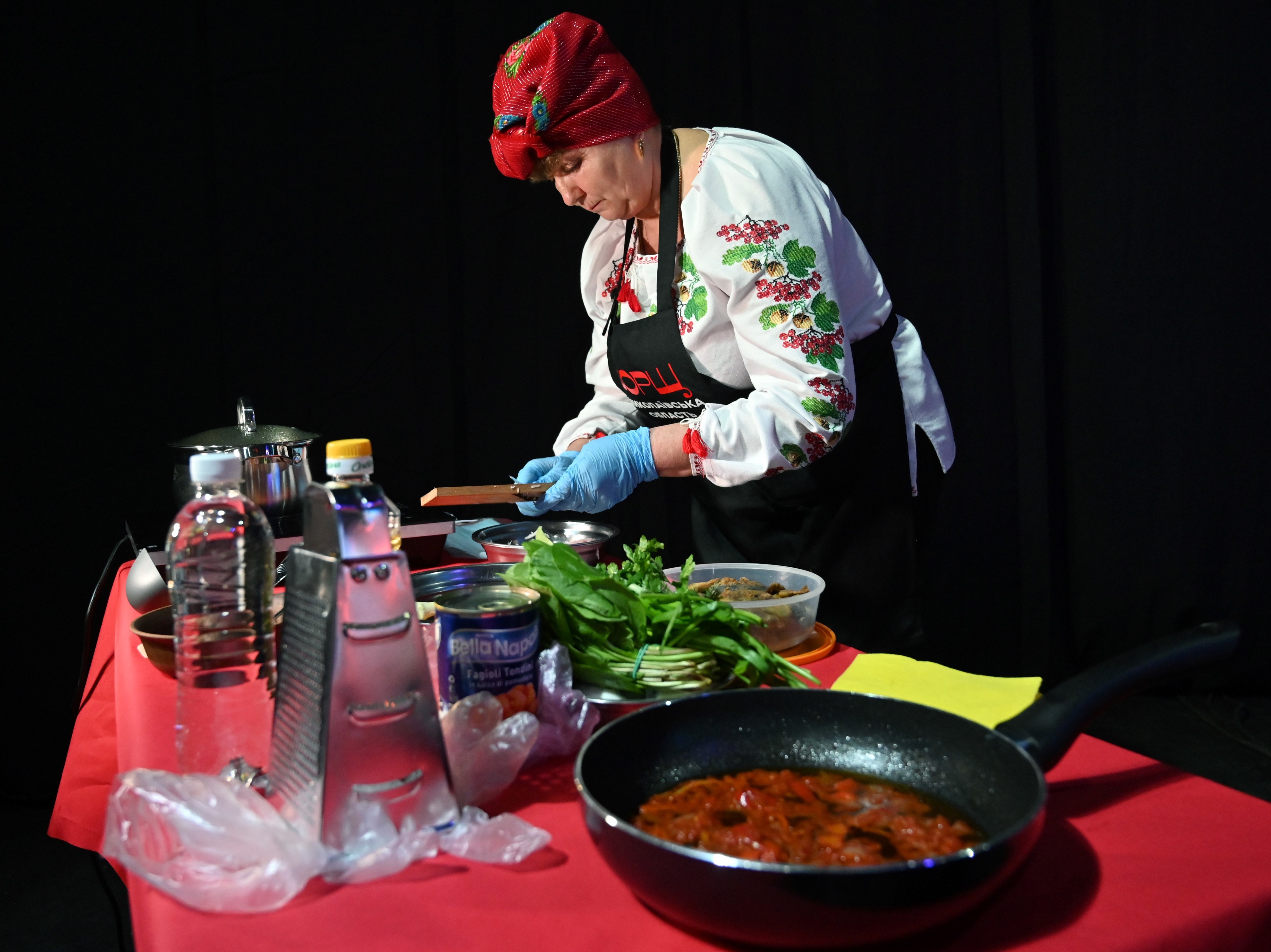 caption: A cook prepares borsch at a March 2021 event in Kyiv to promote Ukraine's bid for UNESCO to recognize the dish as part of the country's historical heritage.