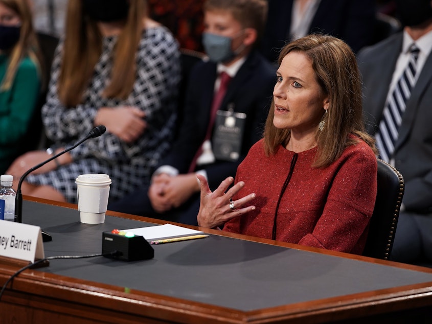 caption: President Trump's Supreme Court nominee Judge Amy Coney Barrett testifies during the second day of her Senate Judiciary confirmation hearing on Tuesday.
