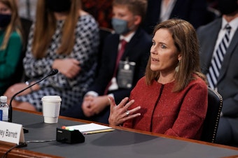 caption: President Trump's Supreme Court nominee Judge Amy Coney Barrett testifies during the second day of her Senate Judiciary confirmation hearing on Tuesday.