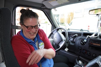 caption: Detta Hayes, 9-year driver for Microsoft's Connector bus and vanpool service. Hayes is prone to frequent bursts of laughter, such as when I asked her if her bus ever gets stuck in traffic.