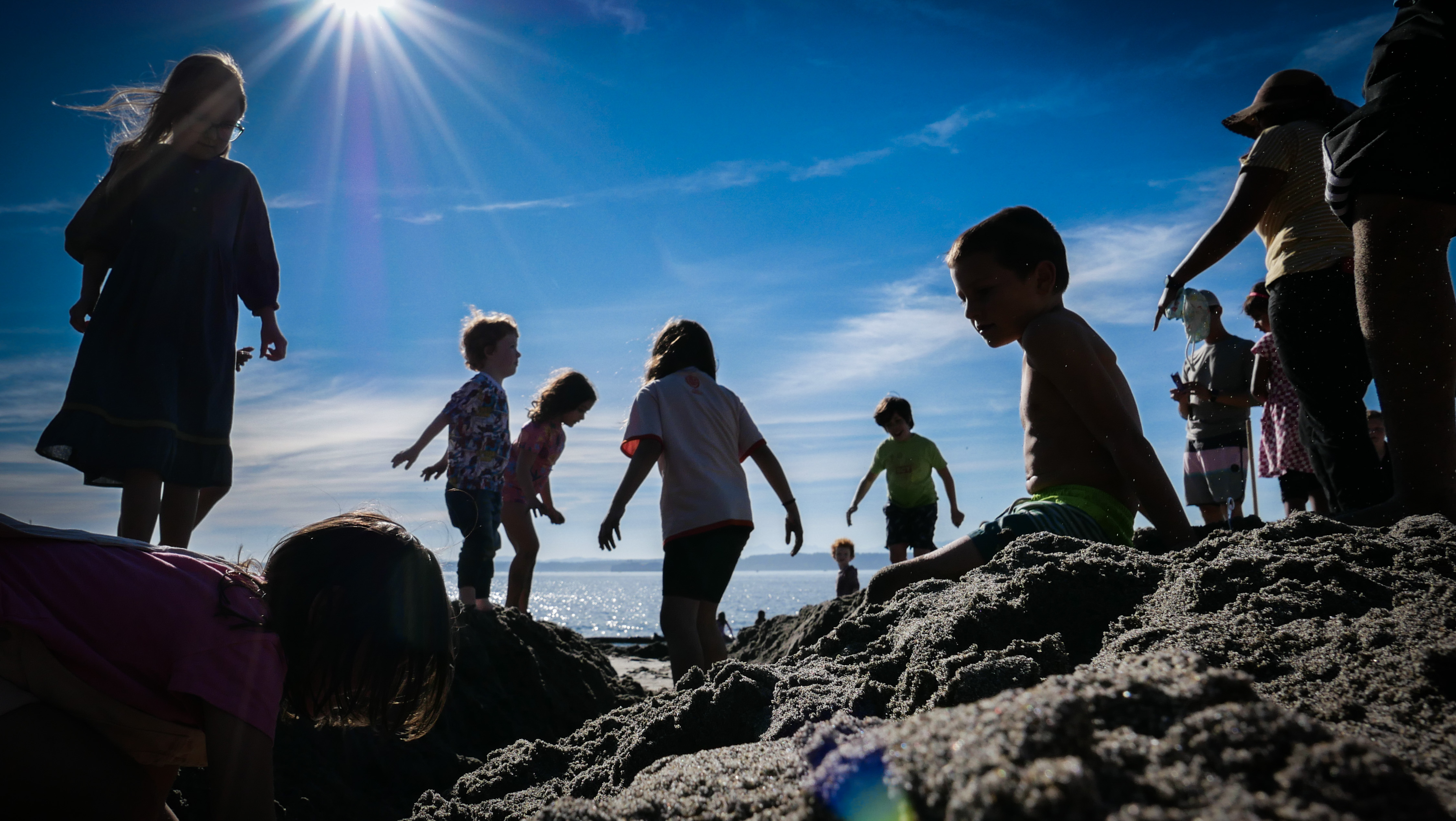 caption: Kids playing in the beach at Golden Gardens Park, September 21st, 2024, last day of summer.