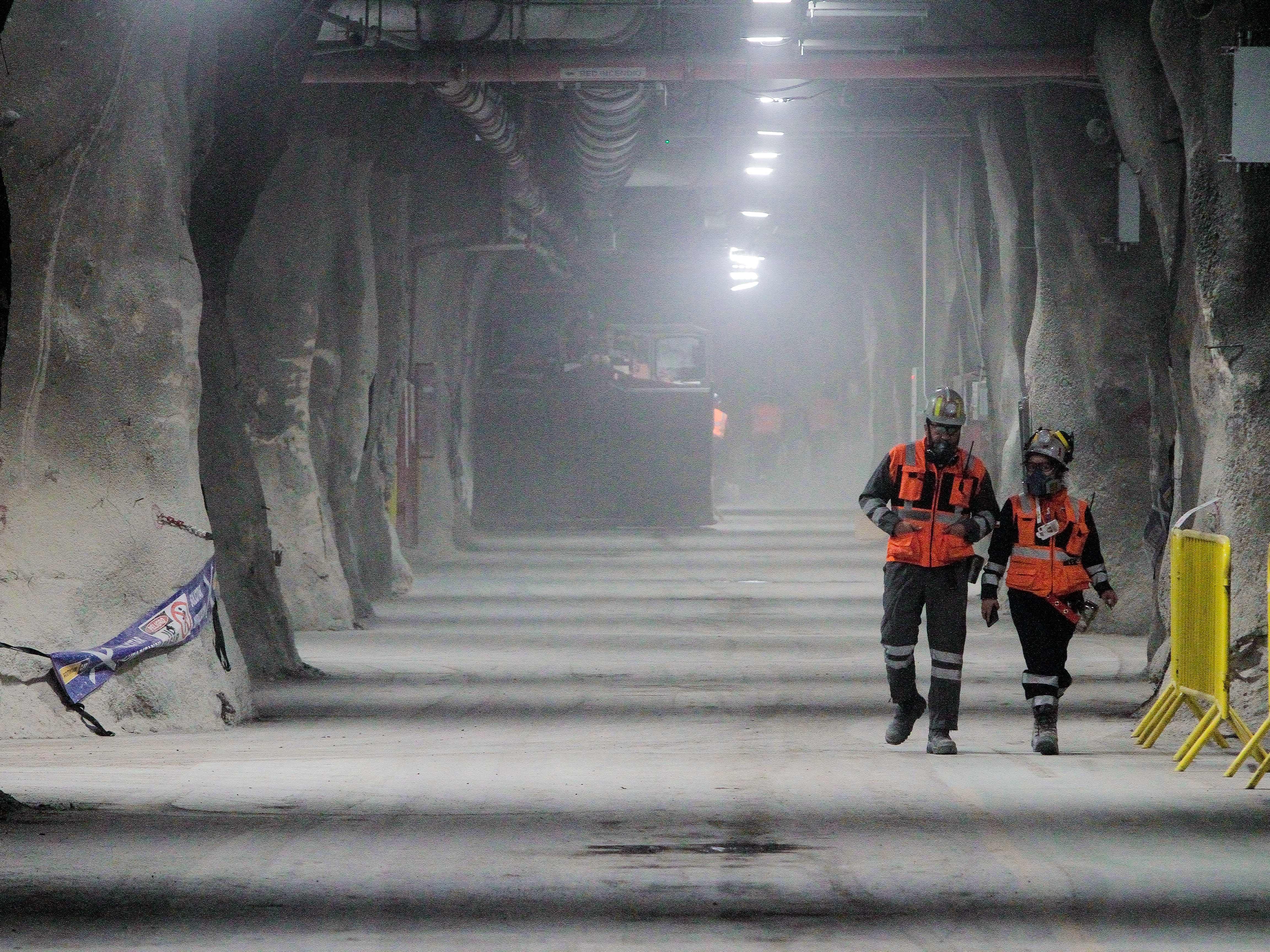 caption: Employees of the Codelco's Chuquicamata copper mine work in Calama in Chile's Antofagasta province, on April 11, 2023.