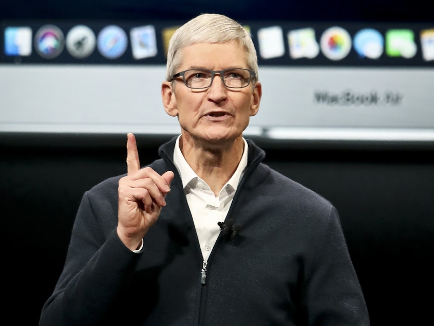 caption: Apple CEO Tim Cook attributed slower sales in China in part to the devaluation of the yuan.