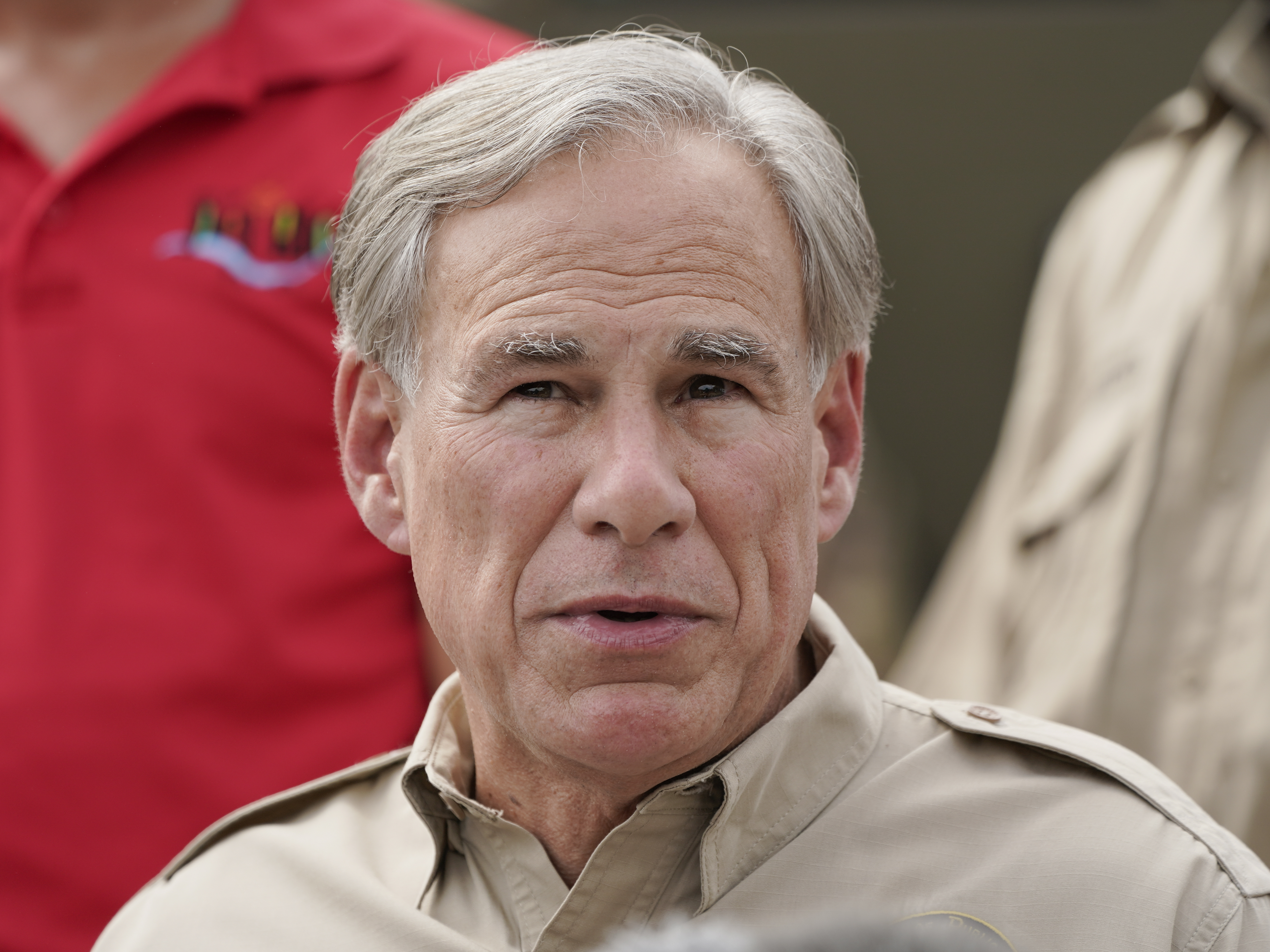 caption: Texas Gov. Greg Abbott speaks near the Rio Grande in September 2021 in Del Rio, Texas. Texas has been leading the legal effort against the Biden administration's border and immigration policies.