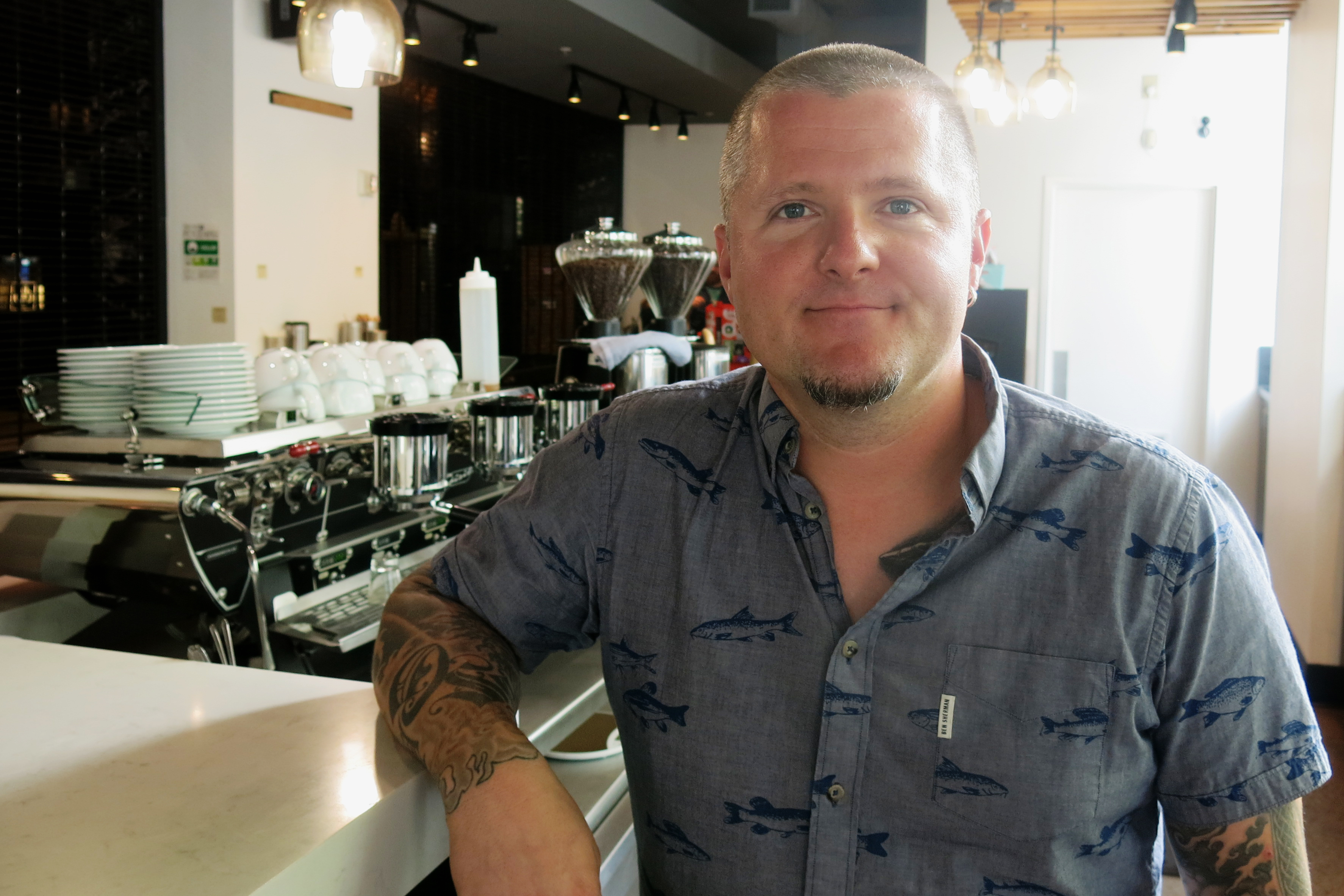 caption: Brendan McGill runs Cafe Hitchcock in downtown Seattle. He served CBD lattes there until the King County health department told him to stop.