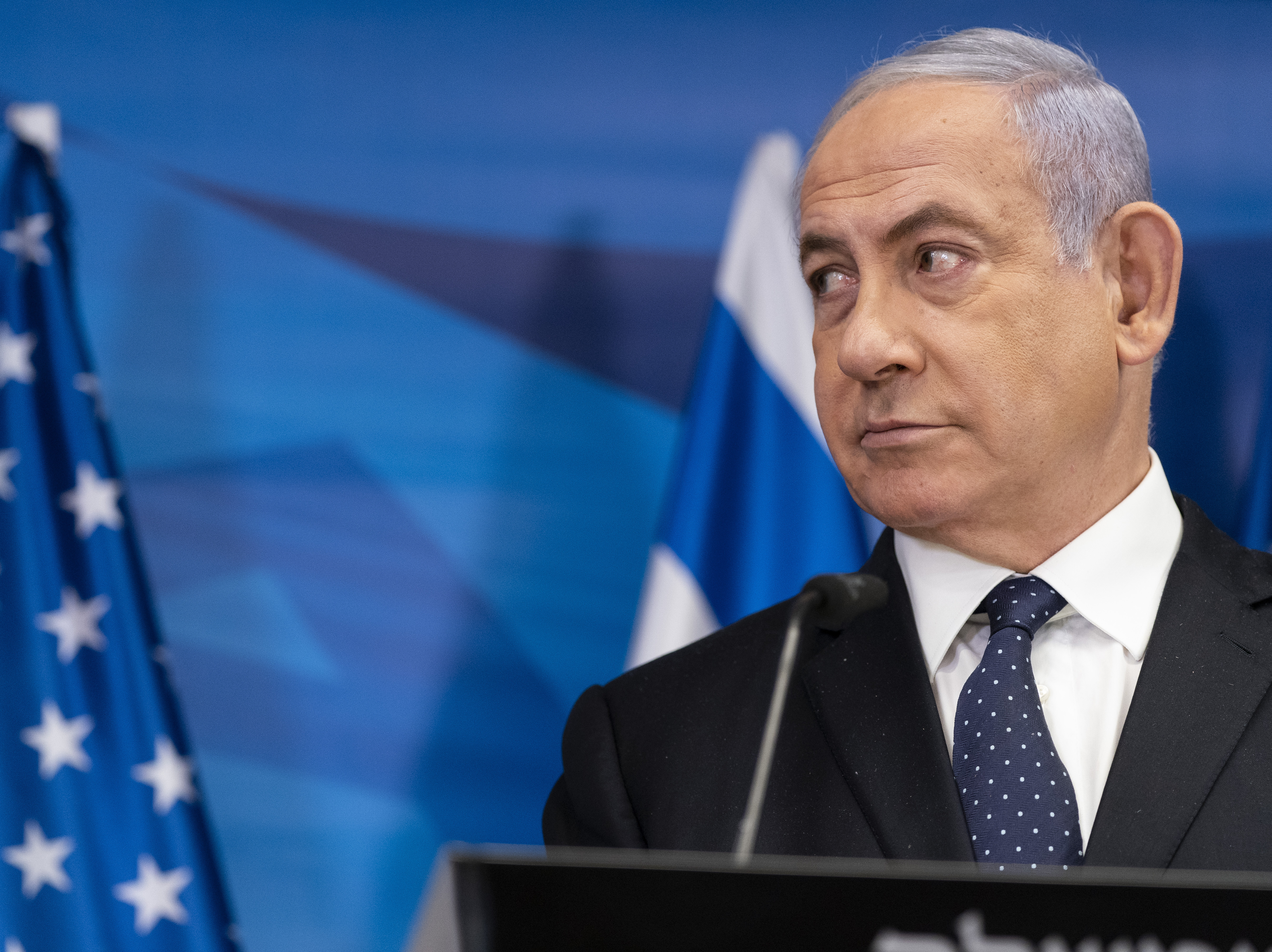 caption: Israeli Prime Minister Benjamin Netanyahu, pictured on May 25, may be out of his position if opponents form a unity government.