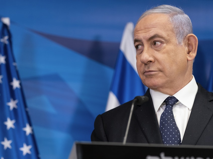 caption: Israeli Prime Minister Benjamin Netanyahu, pictured on May 25, may be out of his position if opponents form a unity government.