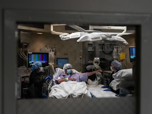 caption: A kidney donor Michael Wingard is being prepared by medical professionals for kidney extraction surgery in an operation room in Houston Methodist Hospital on March 1, 2022 in Houston, Texas.