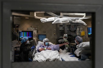 caption: A kidney donor Michael Wingard is being prepared by medical professionals for kidney extraction surgery in an operation room in Houston Methodist Hospital on March 1, 2022 in Houston, Texas.