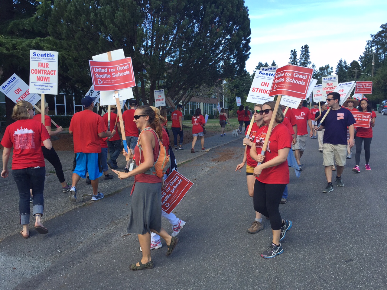 caption: Teachers picket outside Jane Addams Middle School in Seattle's Meadowbrook neighborhood.