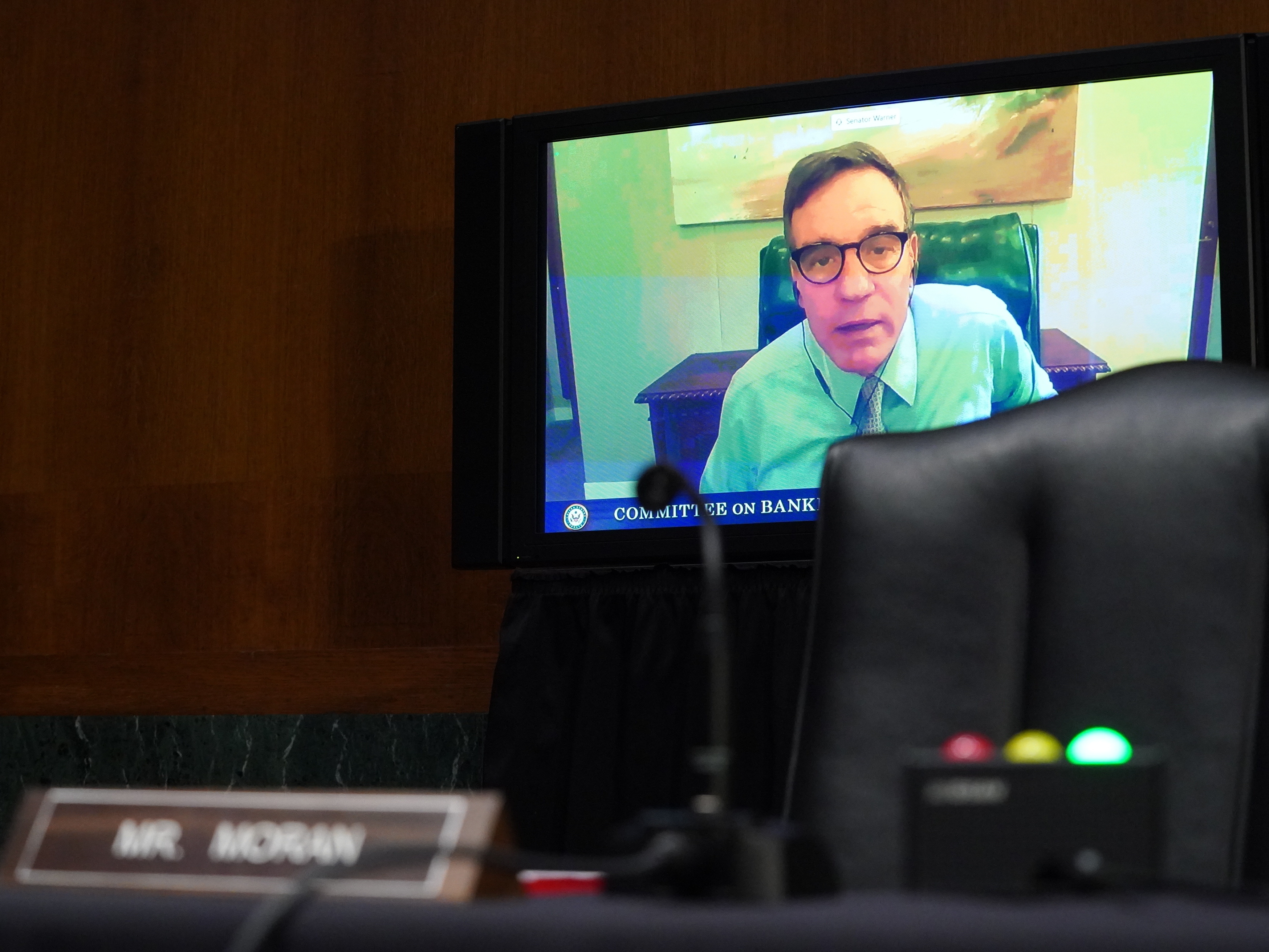caption: Sen. Mark Warner (D-VA) during the Senate's Committee on Banking, Housing, and Urban Affairs hearing examining the quarterly CARES Act report to Congress on September 24, 2020 in Washington, DC.