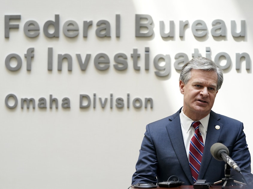 caption: FBI Director Christopher Wray speaks during a news conference Wednesday in Omaha, Neb.