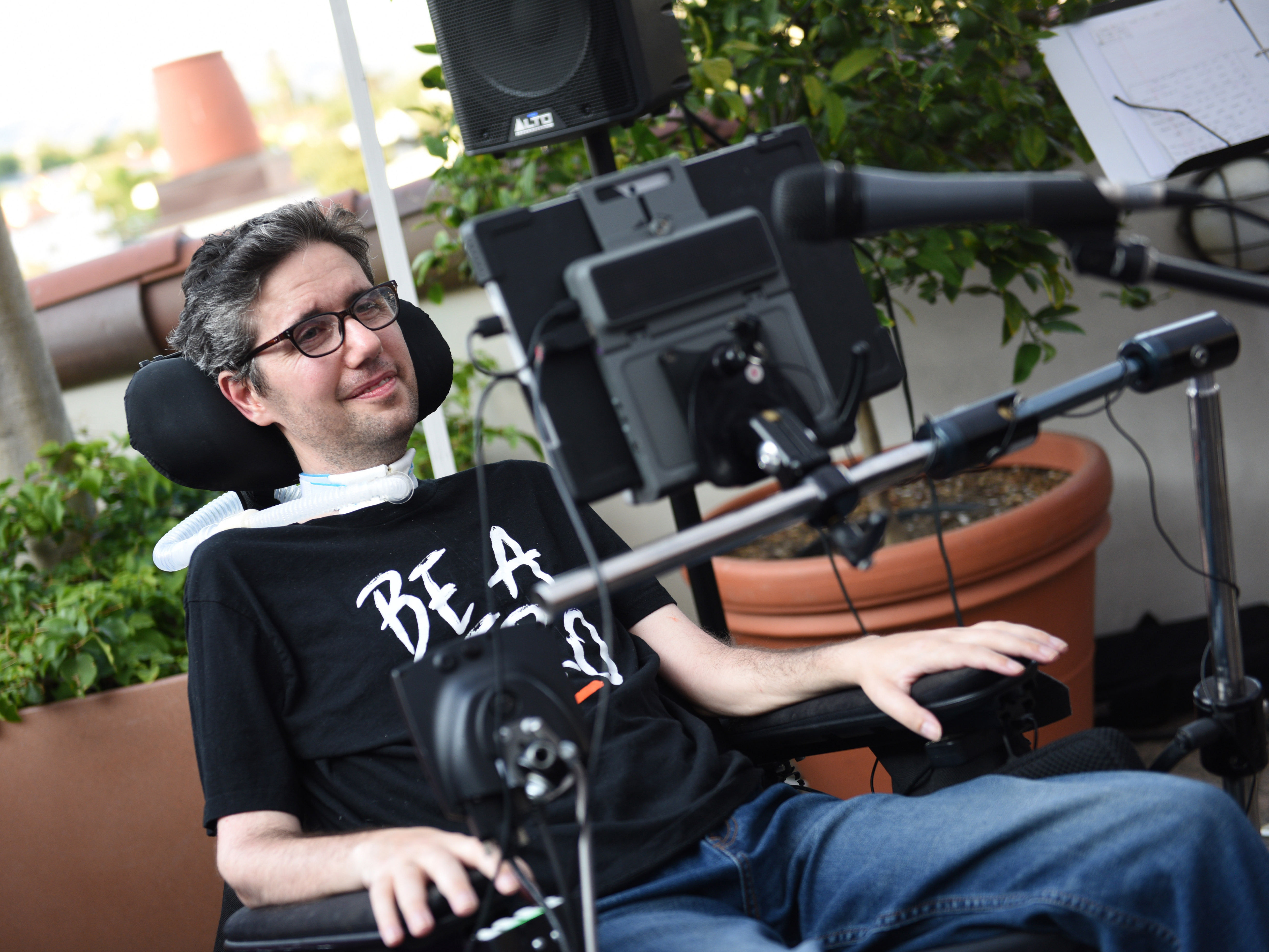 caption: Ady Barkan speaks at the premiere of his documentary <em>Not Going Quietly</em> in August 2021 in Los Angeles.