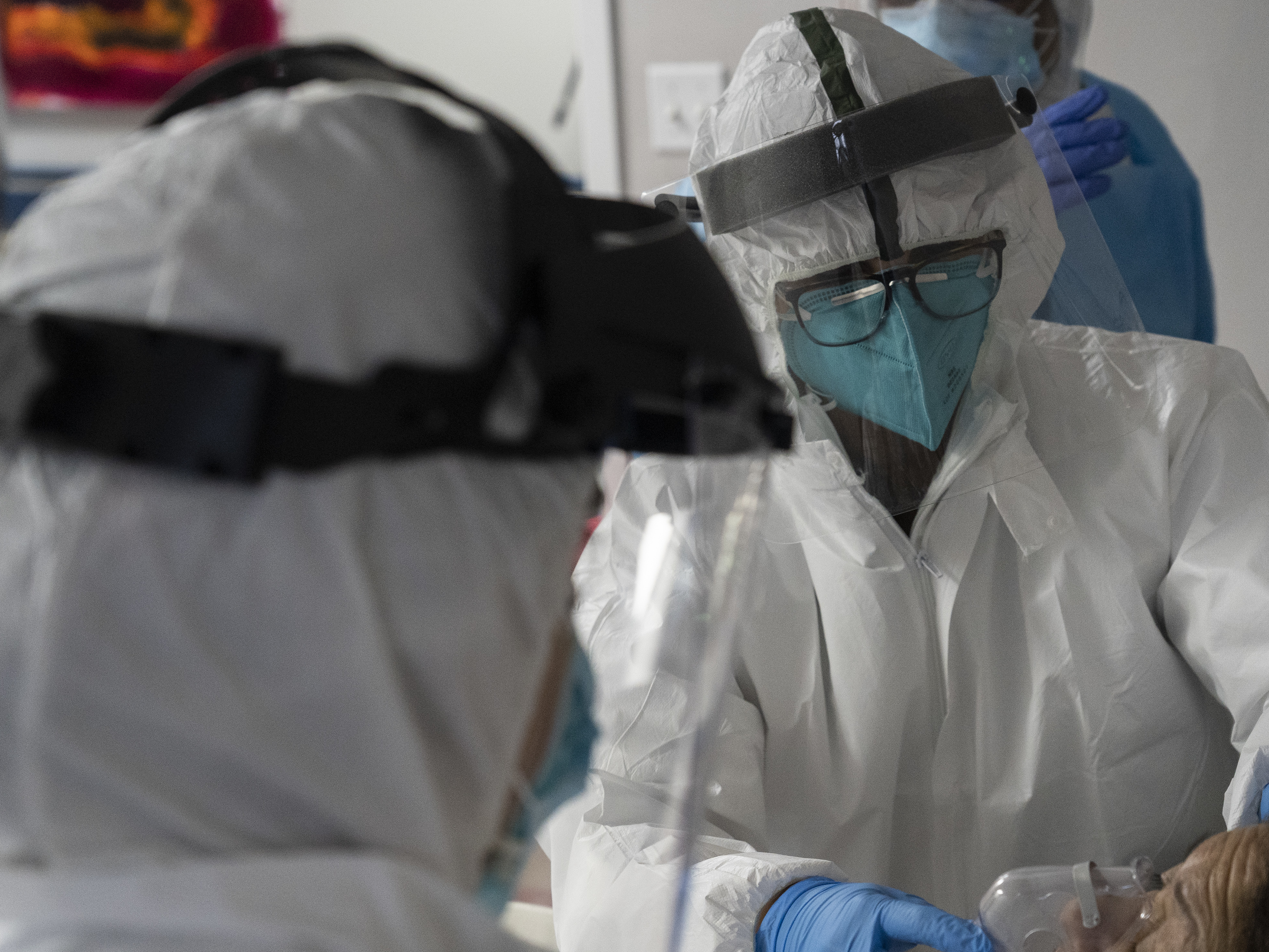 caption: The U.S. hit a record high coronavirus hospitalization rate Wednesday, putting further strain on the nation's already stressed hospitals.