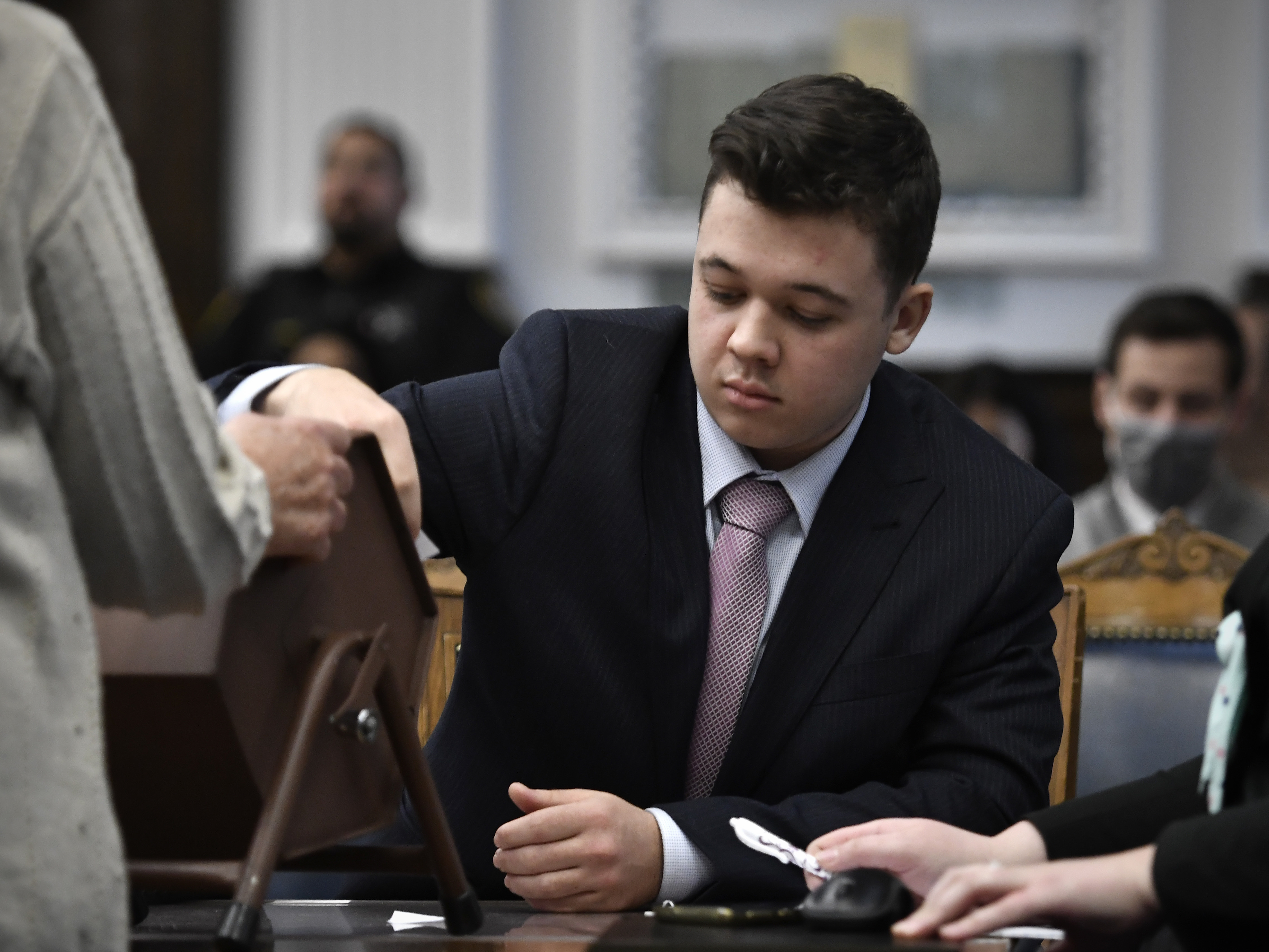 caption: Kyle Rittenhouse at the Kenosha County Courthouse on Tuesday. Rittenhouse faces five felony counts for shooting three people in Kenosha, Wis., on the night of Aug. 25, 2020.