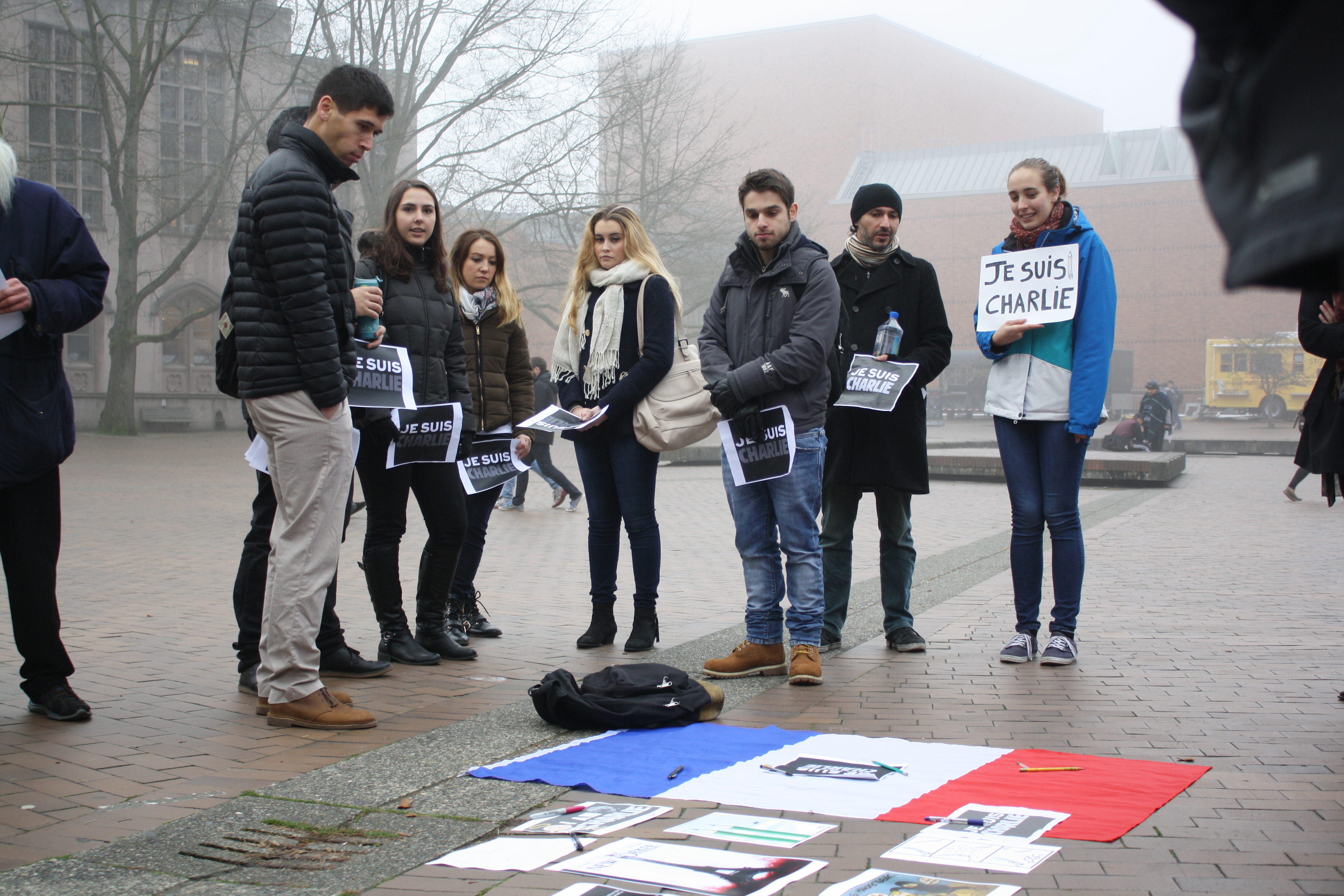 caption: A small gathering at Red Square to discuss the events that have unfolded in Paris.