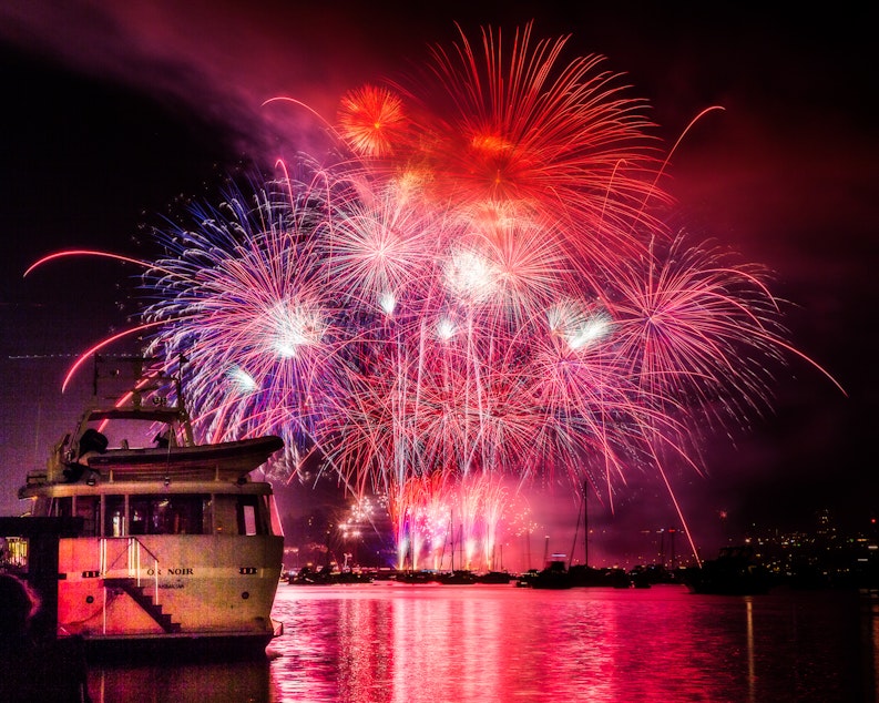 caption: A display of fireworks on Seattle's Lake Union in 2014. 