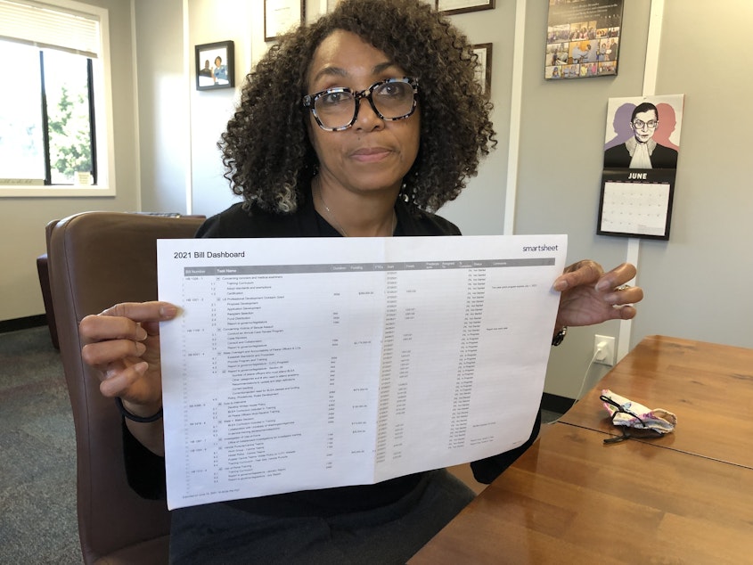 caption: Criminal Justice Training Commission director Monica Alexander uses a spreadsheet to track all of the state's new police reform legislation. 
