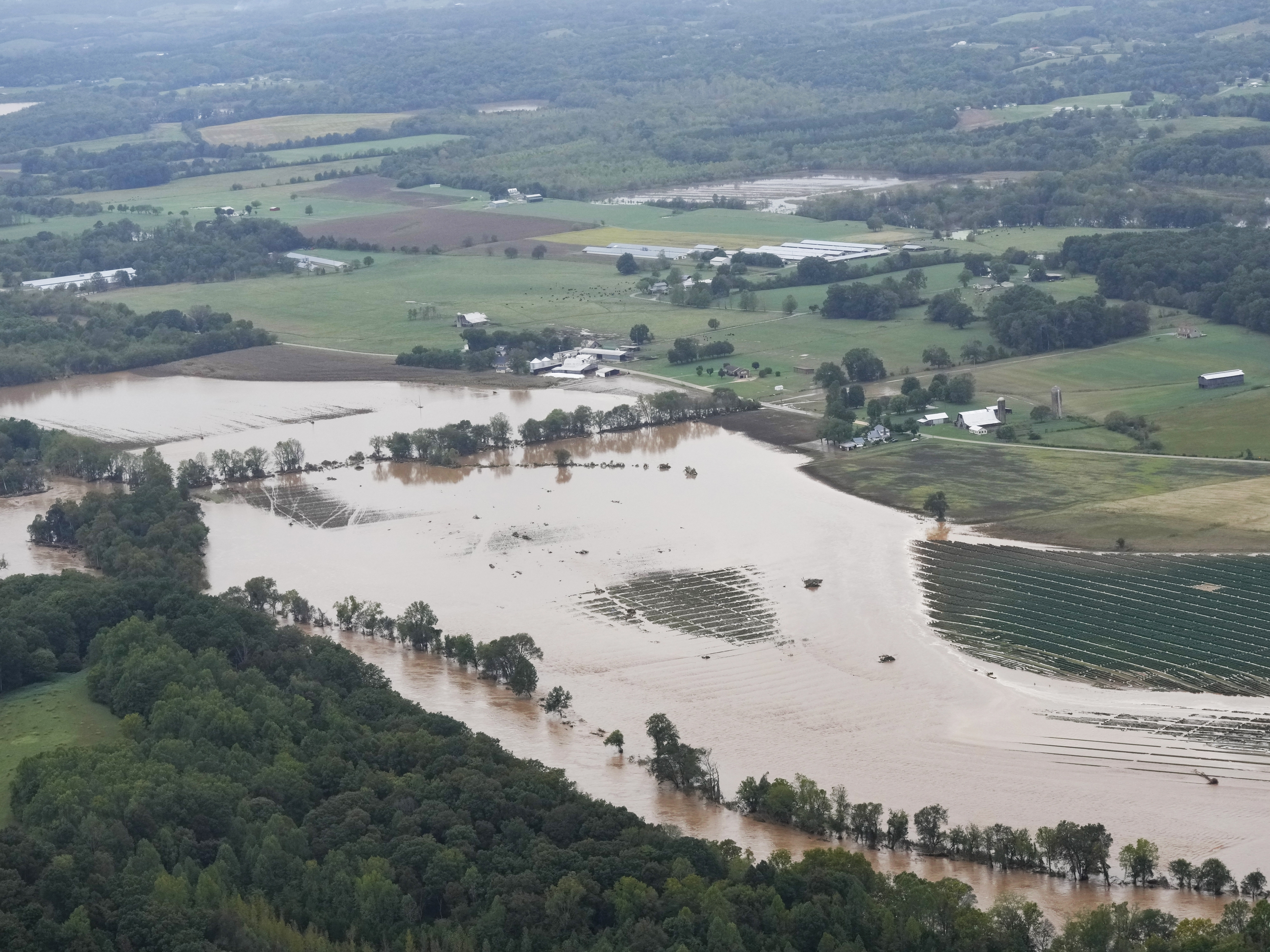 caption: An aerial view shows flood damage left by Hurricane Helene along the Nolichucky River in norteastern Tennessee on Sept. 28. ecovery has been slow in the mountainous area of eastern Tennessee and western North Carolina.