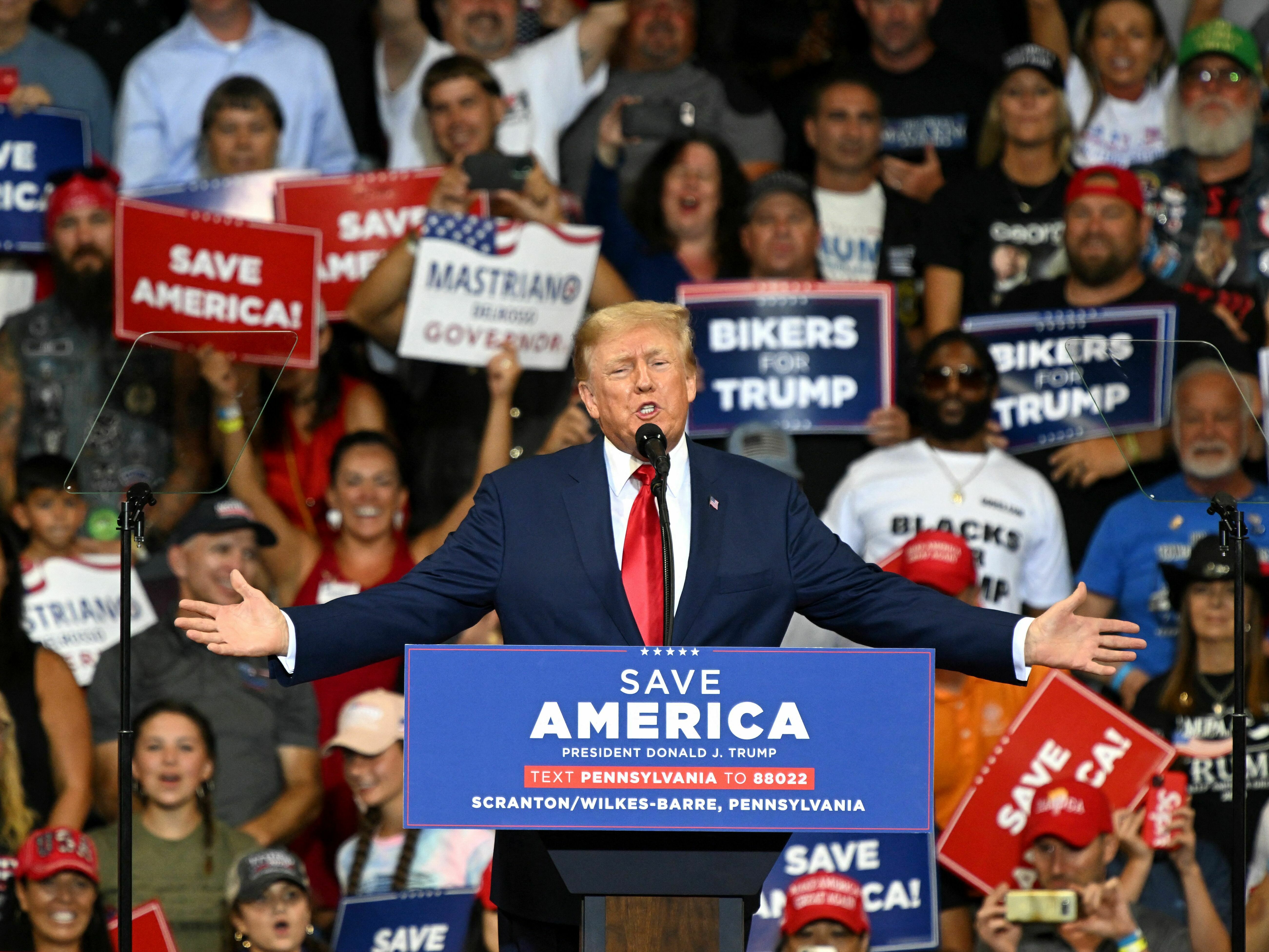 caption: Former President Donald Trump speaks during a campaign rally in September 2022. At the rally, Trump invited the president and founder of the nonprofit Patriot Freedom Project to give a speech. The group's close ties to Trump have prompted scrutiny from lawmakers.