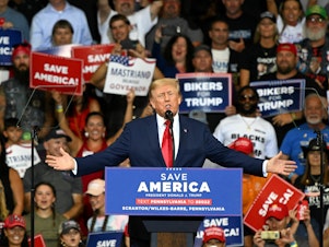 caption: Former President Donald Trump speaks during a campaign rally in September 2022. At the rally, Trump invited the president and founder of the nonprofit Patriot Freedom Project to give a speech. The group's close ties to Trump have prompted scrutiny from lawmakers.