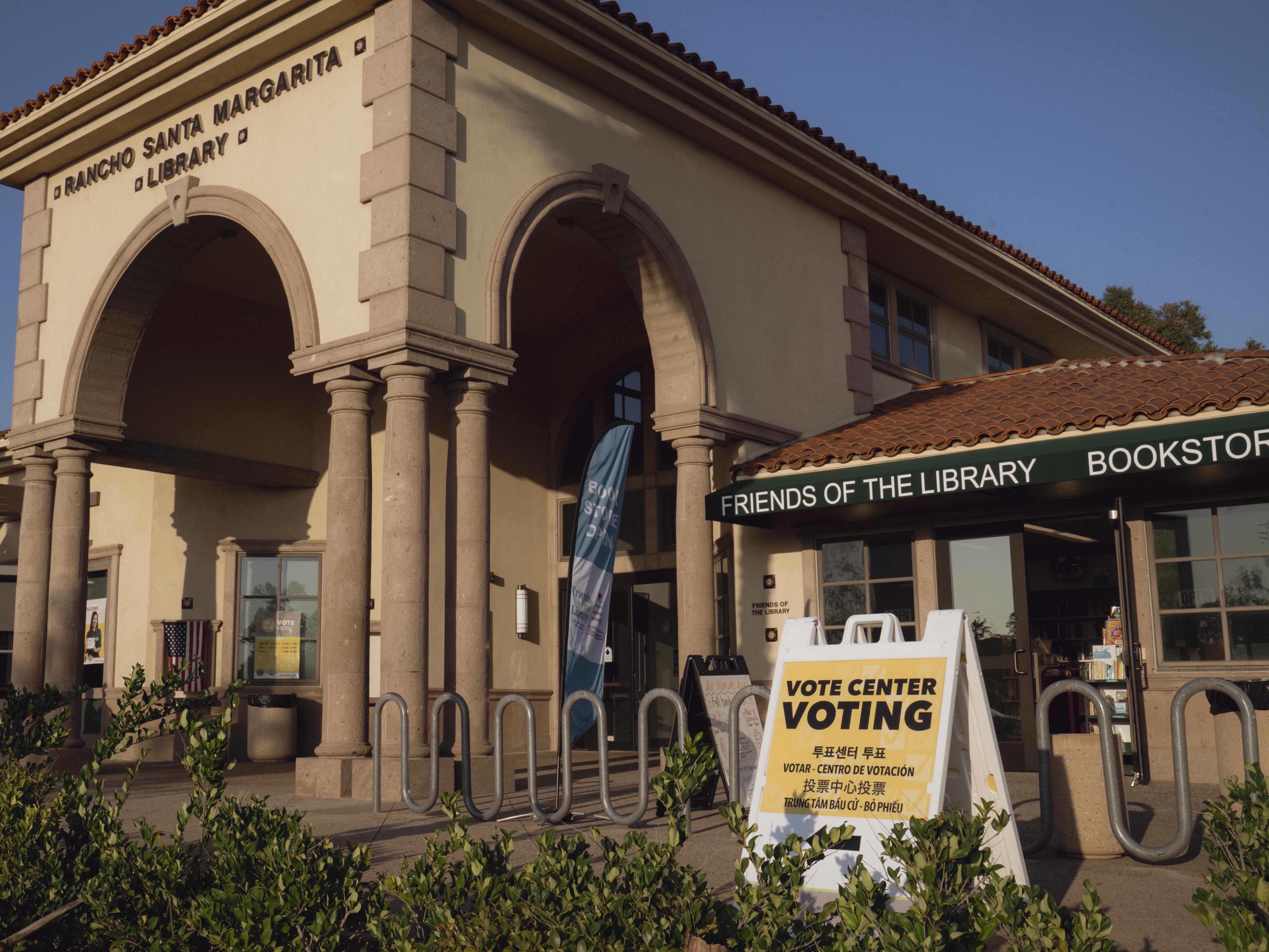 caption: Voting signs for California's special election outside of the Rancho Santa Margarita Library in Orange County. California voters are deciding Proposition 50, which would allow the state's Democratic leaders to temporarily bypass California's independent redistricting commission and enact a more Democratic-friendly congressional map ahead of next year's midterm elections.