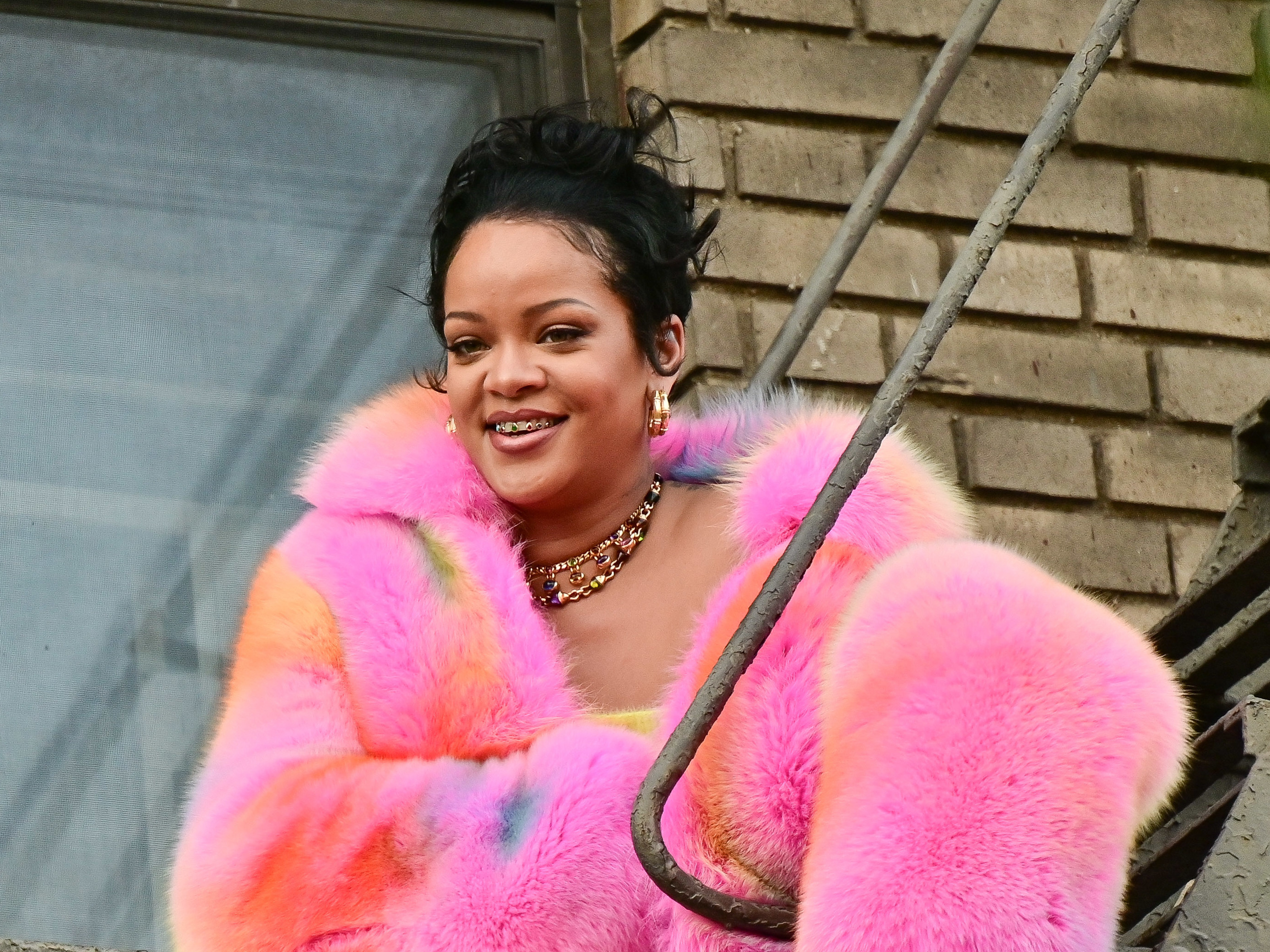 caption: Rihanna, seen on the set of a music video in the Bronx on July 11, is estimated to have a fortune of $1.7 billion.