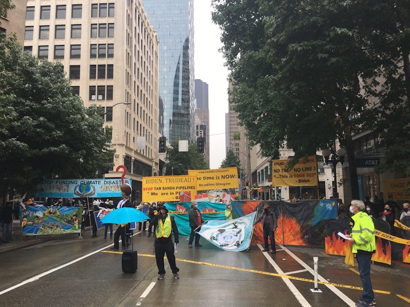 caption: Climate activists block Fourth Avenue in downtown Seattle on Friday.