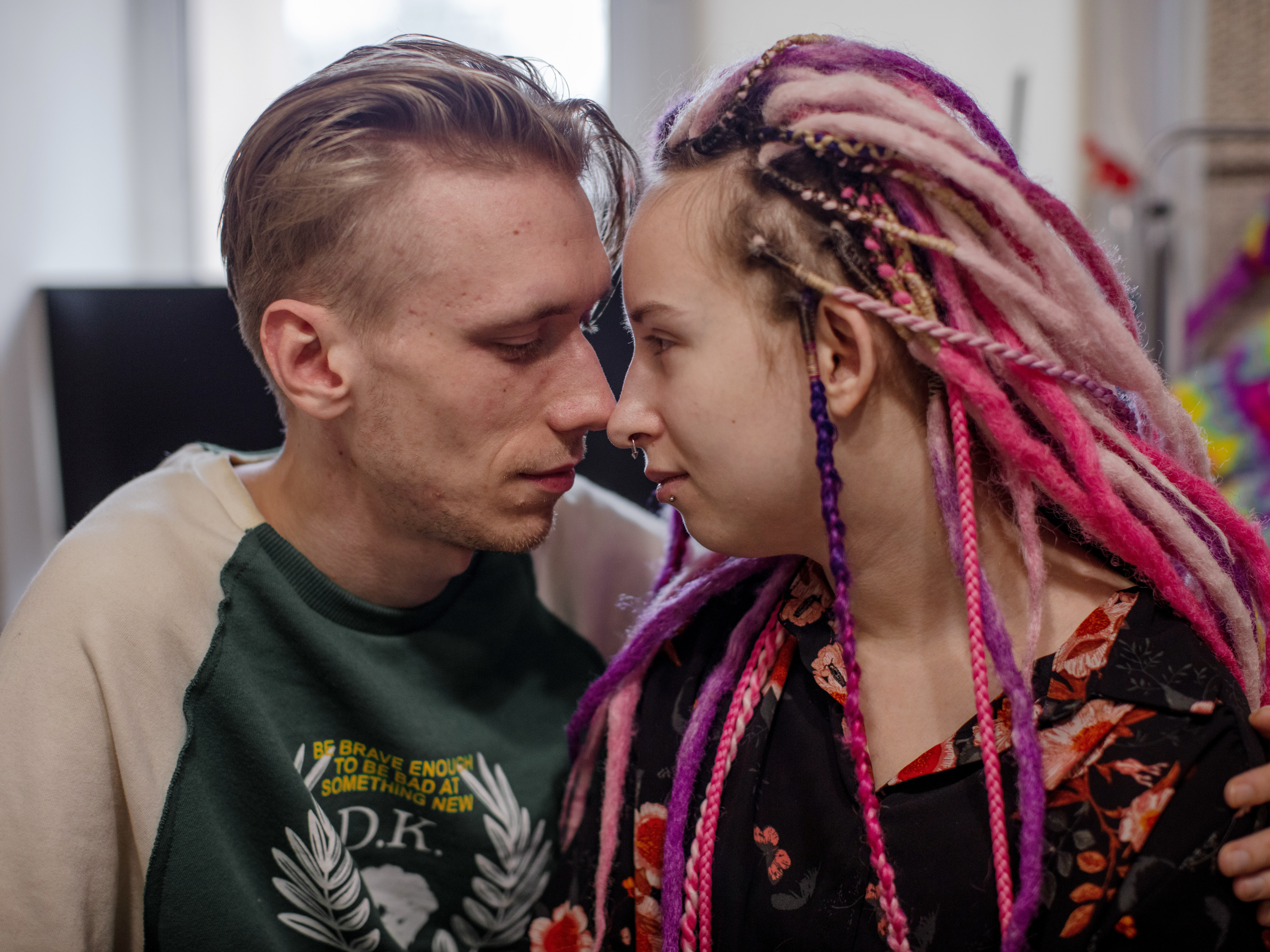 caption: Maksim Manakhov, 23, and Lilya Lohyna, 22, fell in love after Russian forces encircled their home of Kharkiv and it became the site of near constant shelling for months.
