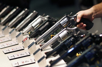 caption: Handguns are displayed at a trade show in Las Vegas. The Supreme Court is granting a case on gun rights for the first time since 2010. CREDIT: JOHN LOCHER/AP