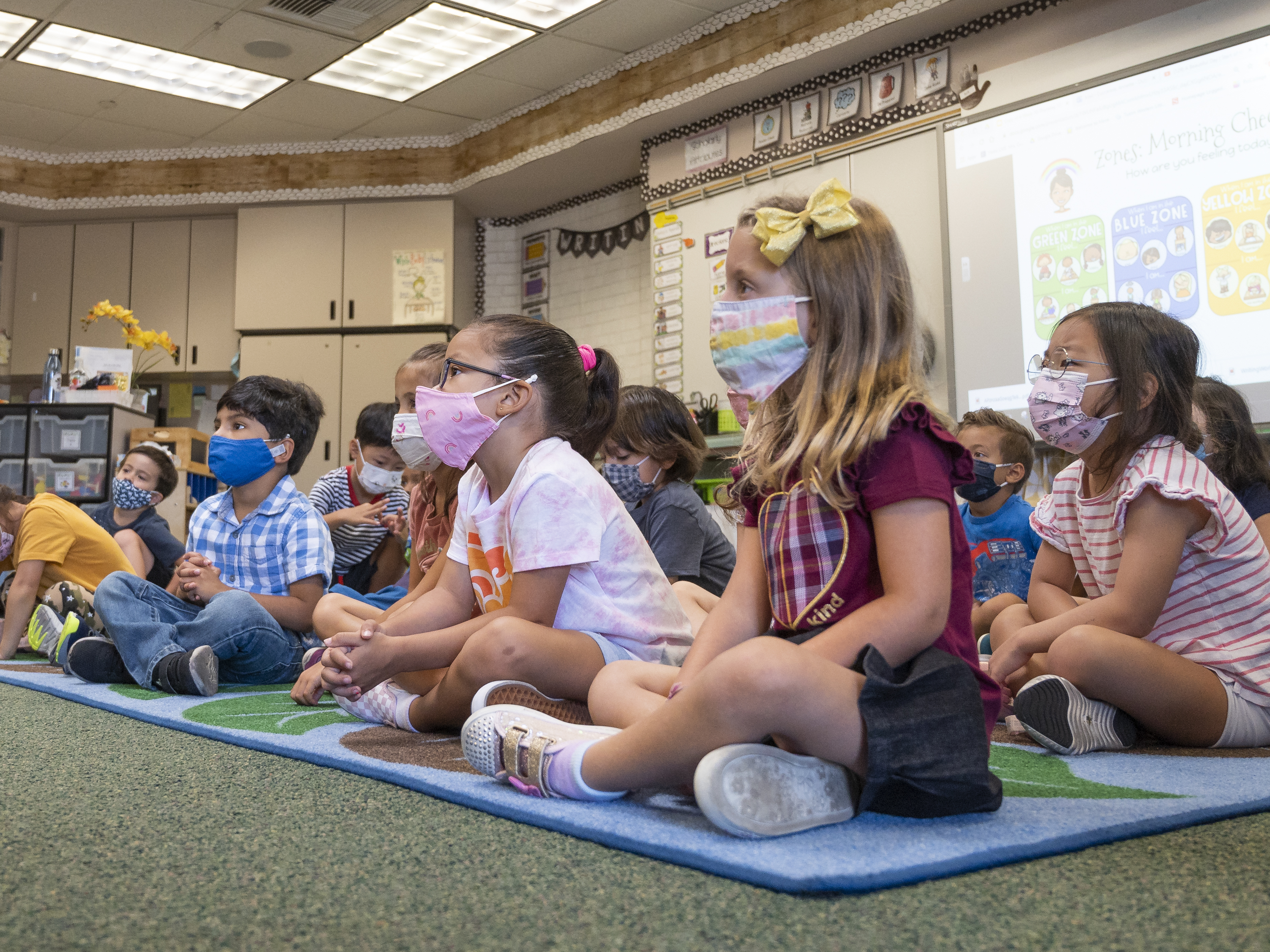 caption: Students listen to their teacher during their first day of transitional kindergarten this month at Tustin Ranch Elementary School in Tustin, Calif.