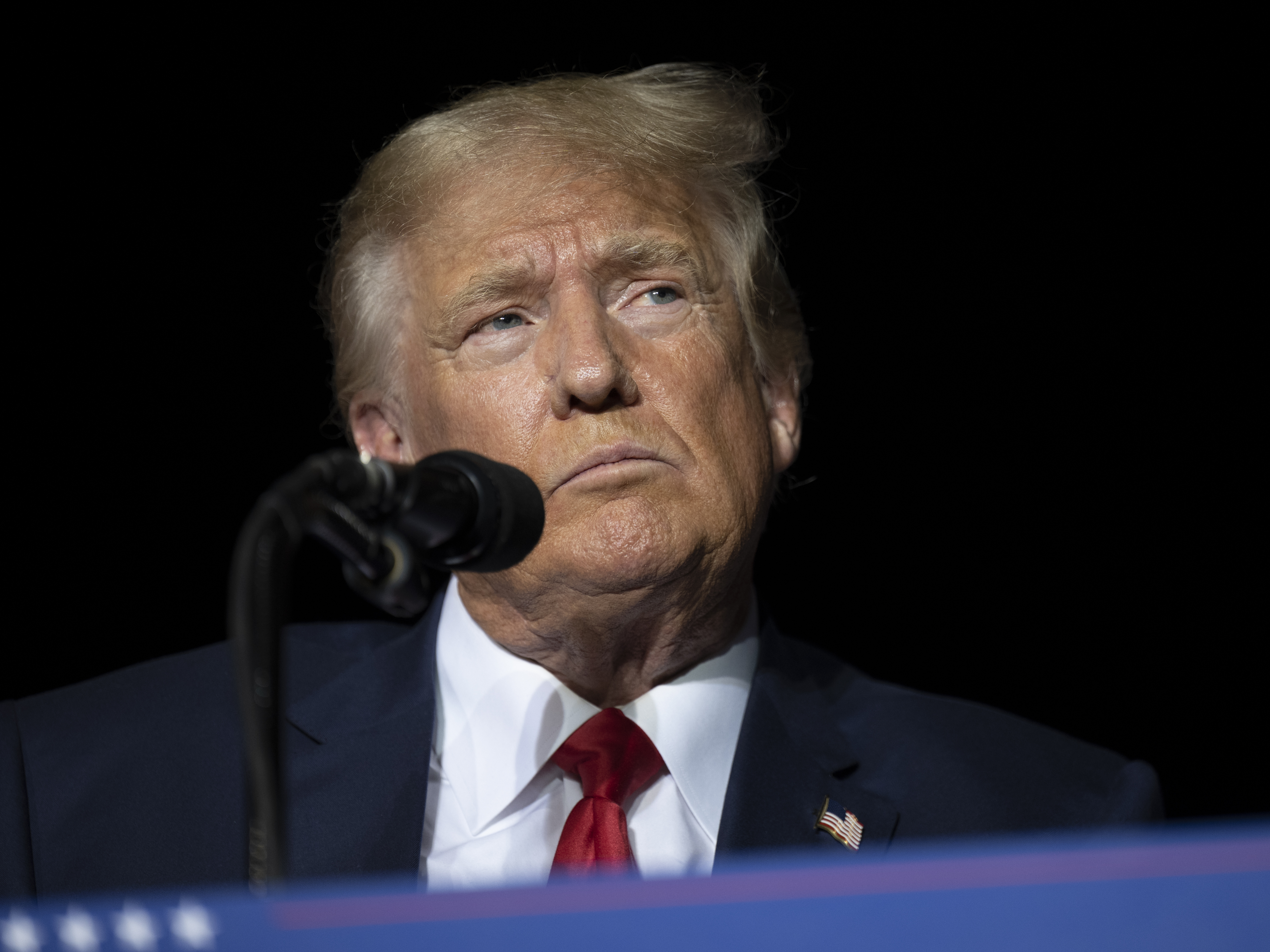 caption: Former President Donald Trump pauses while speaking at a rally at the Minden Tahoe Airport in Minden, Nev., on Oct. 8, 2022.