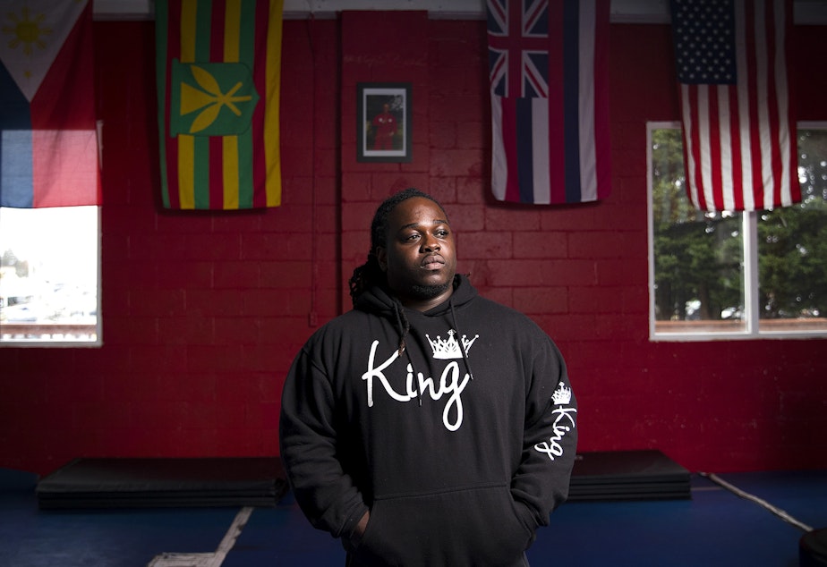 caption: Will Jimerson Jr. poses for a portrait at Emperado Kajukenbo Seattle Academy, a gym where he works with youth and young adults that are at risk of involvement with the justice system on Thursday, October 25, 2018, in Seattle.