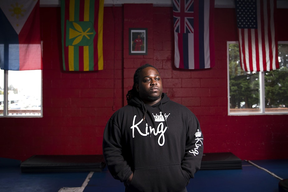 caption: Will Jimerson Jr. poses for a portrait at Emperado Kajukenbo Seattle Academy, a gym where he works with youth and young adults that are at risk of involvement with the justice system on Thursday, October 25, 2018, in Seattle.