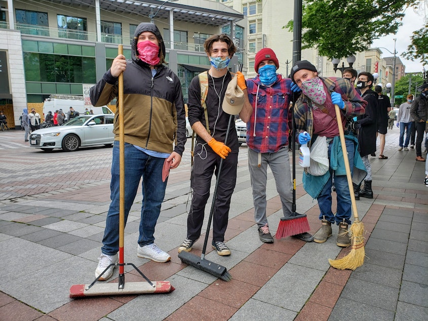 caption: From left: Lad, Dorian, Quinten, and Oliver Issa joined dozens of volunteers to cleanup downtown on Sunday, May 31st, 2020.