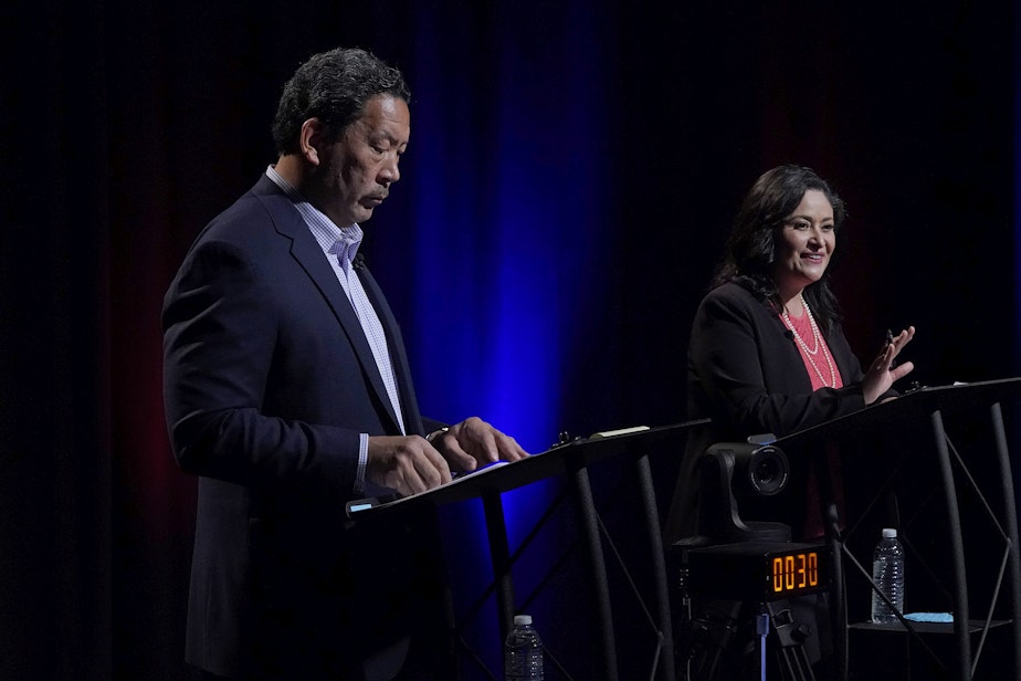 caption: Bruce Harrell, left, and Lorena Gonzalez, right, take part Thursday, Oct. 14, 2021, in the first of two debates in Seattle scheduled before the November election for the office of mayor. 