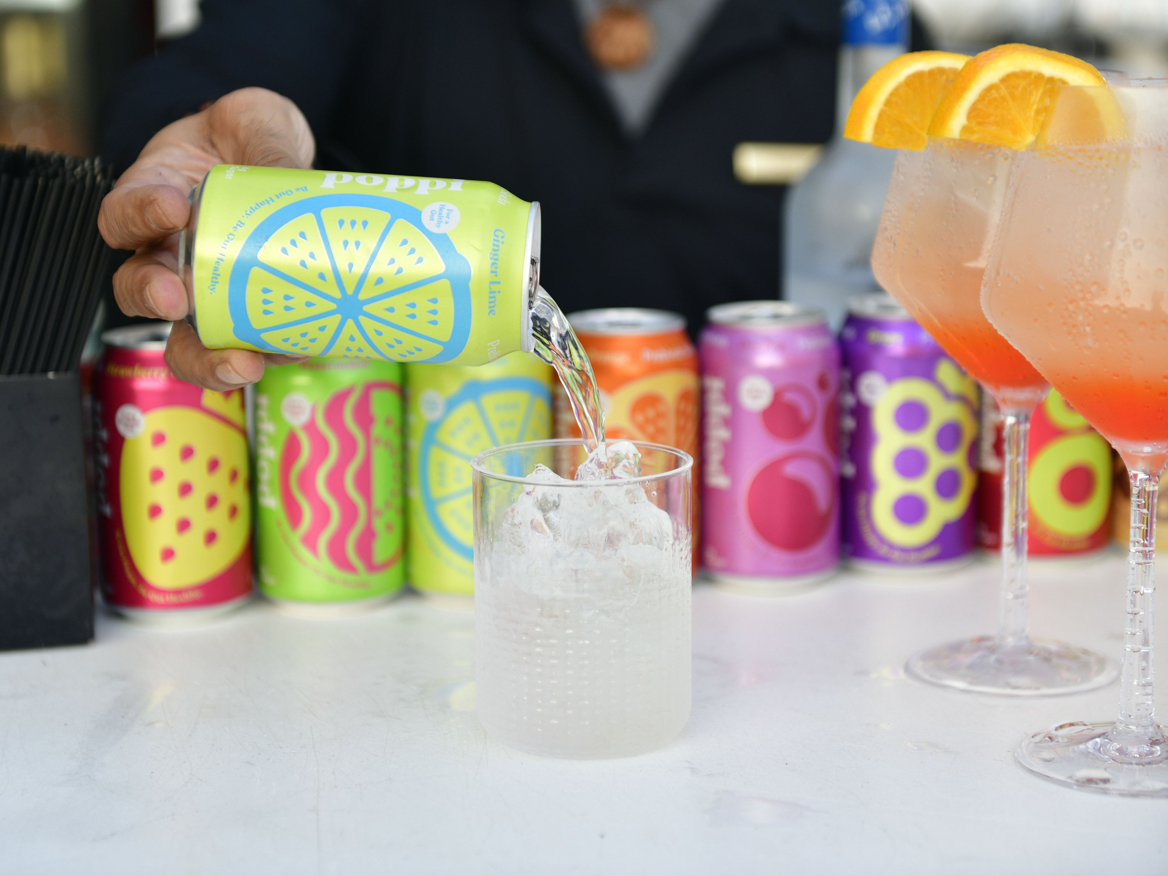 caption: Sodas like Poppi and Olipop have added prebiotic ingredients intended to help nourish your gut bacteria.